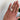 close-up of hand wearing a Emerald Lab Grown Diamond 14k Gold Engagement Ring. Custom engagement ring in San Diego, CA