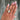 close-up of hand wearing an elongated cushion Lab Grown Diamond 14k Gold Engagement Ring. Custom engagement ring in San Diego, CA