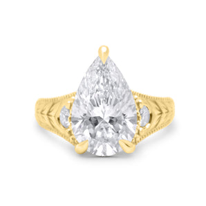 Gabby | Pear cut Moissanite  Chevron Engraved Two Round Diamond 14k Yellow Gold Engagement Ring - Diamond Daughters, Front View